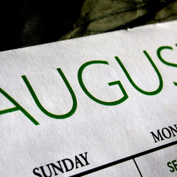 A close up of the word august written on paper