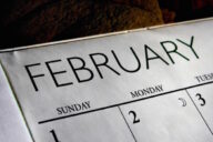 A close up of the calendar with the word february written on it