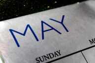 A close up of the word may on a calendar
